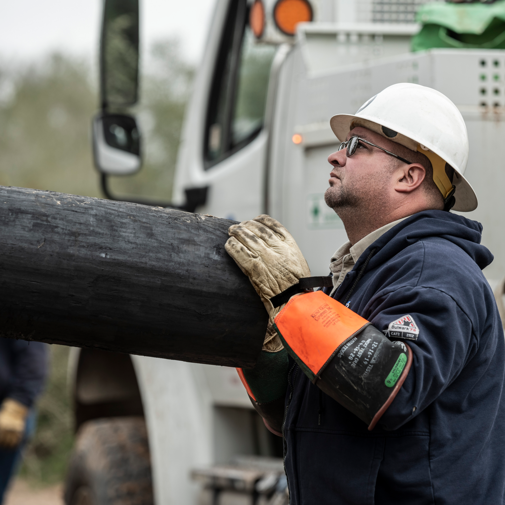 lineworker lifting pole